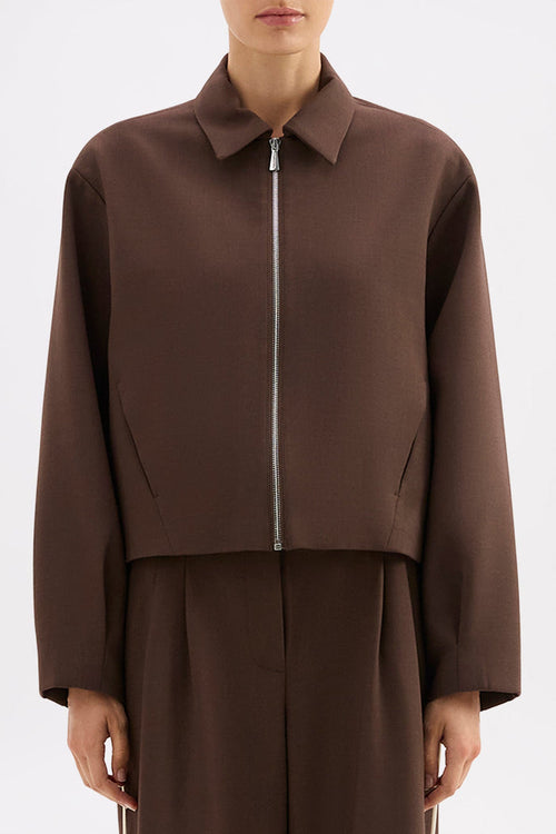 Brown jacket and pants set on a white background