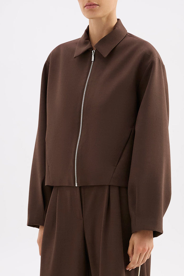 Brown jacket and pants set on a white background