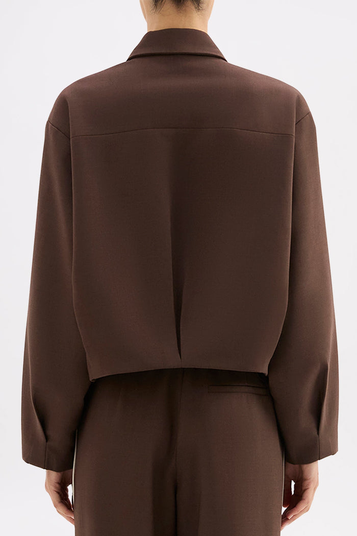 Brown suit jacket and pants on a white background