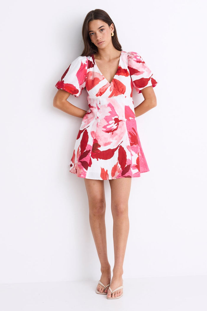 woman wearing red white pink floral mini dress