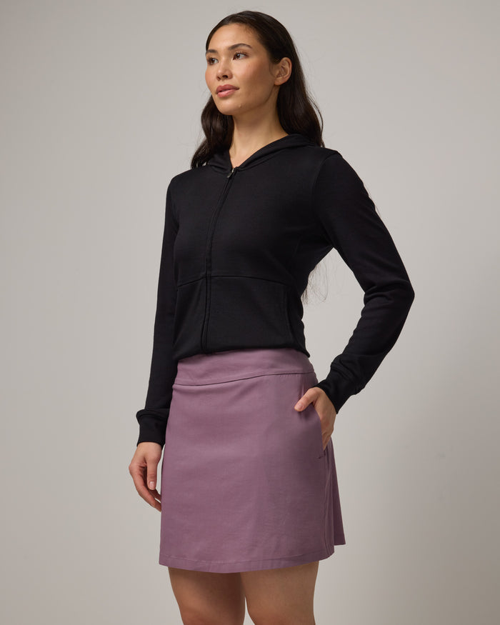 Model wearing Adventure Skort in Lavender. Adventure Skort is a merino wool above-knee length skort with pockets available in sizes XS-XXL.