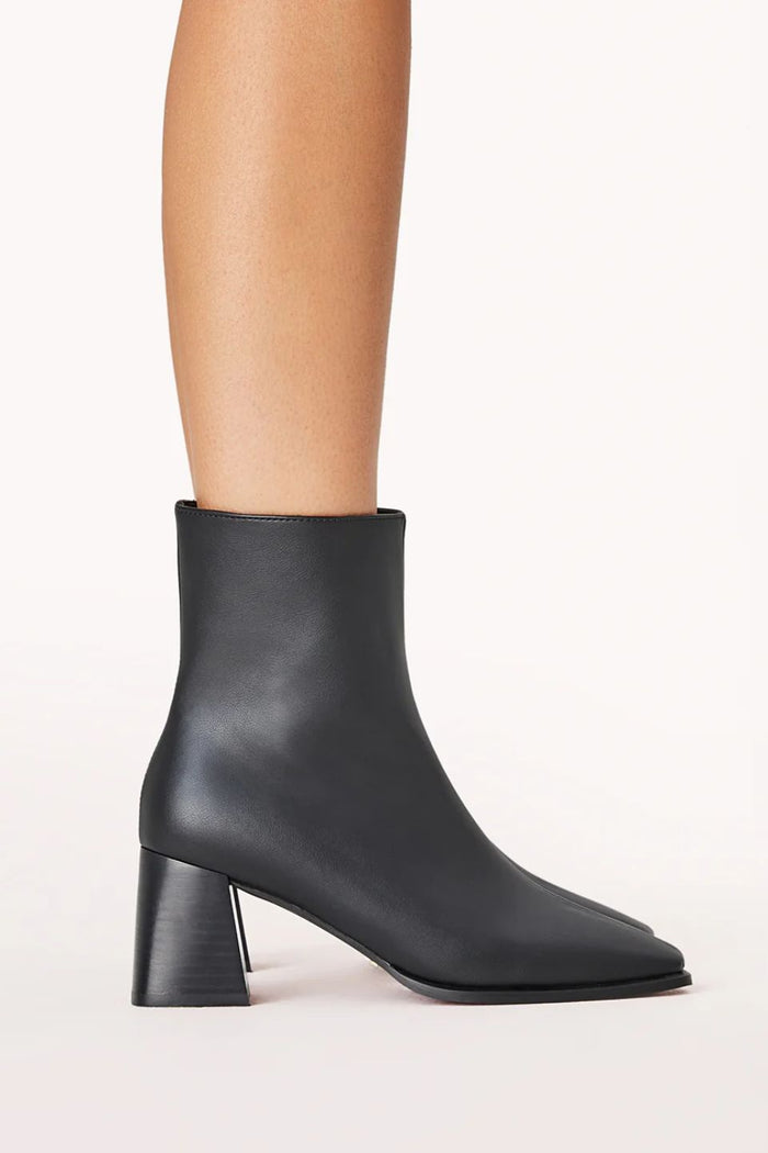 Black ankle boot on a white background