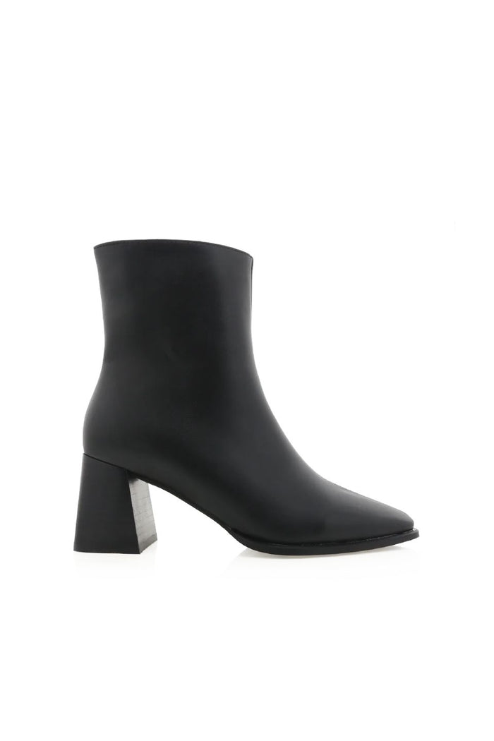 Black ankle boot with a block heel on a white background