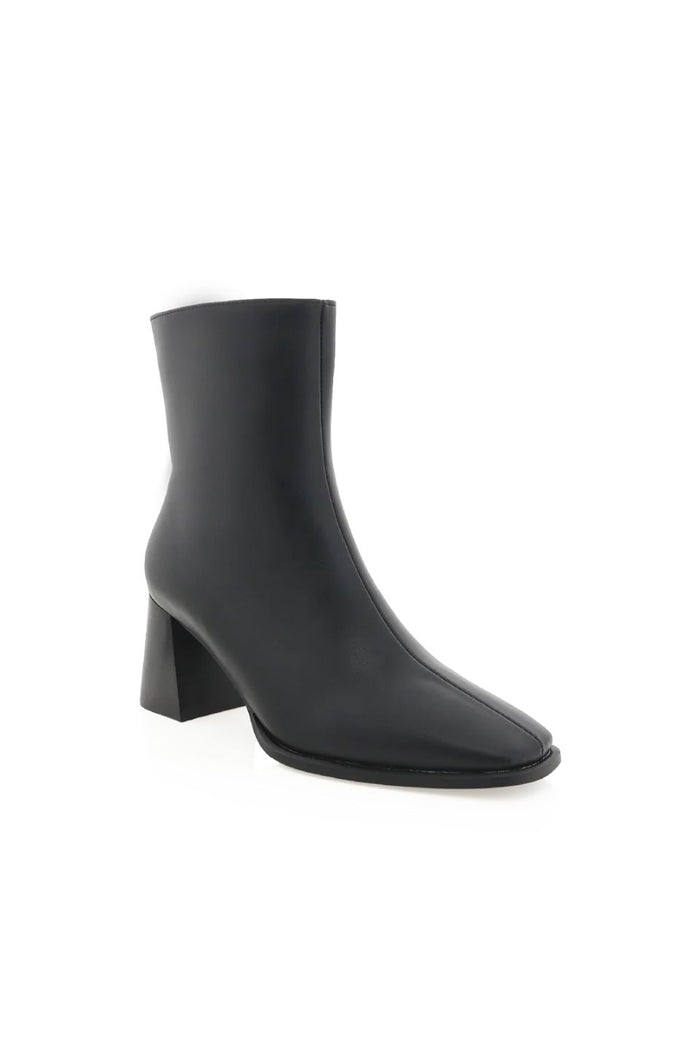 Black ankle boot on a white background