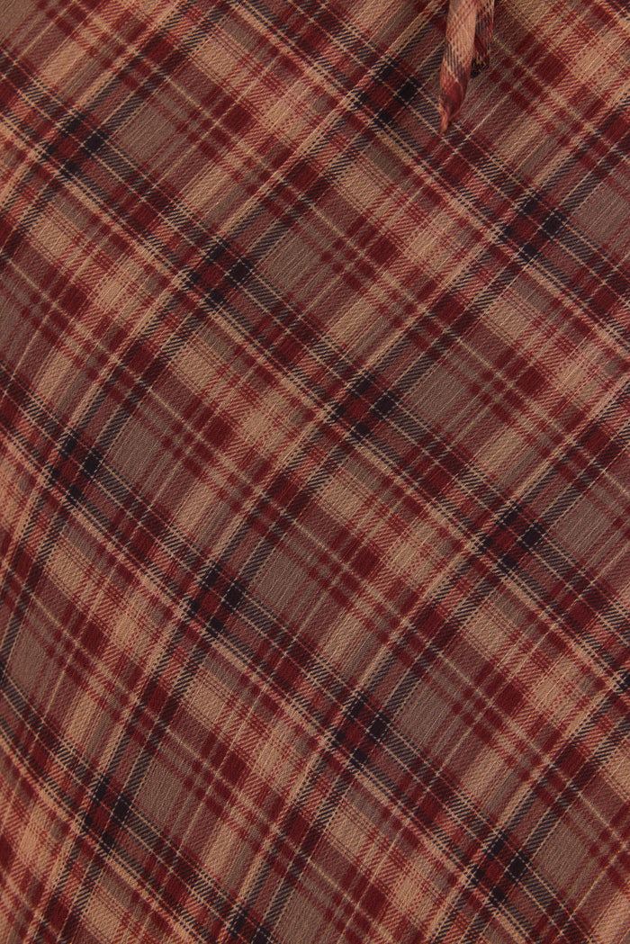 Close-up of a plaid fabric with brown, beige, and black colors.
col_pattern