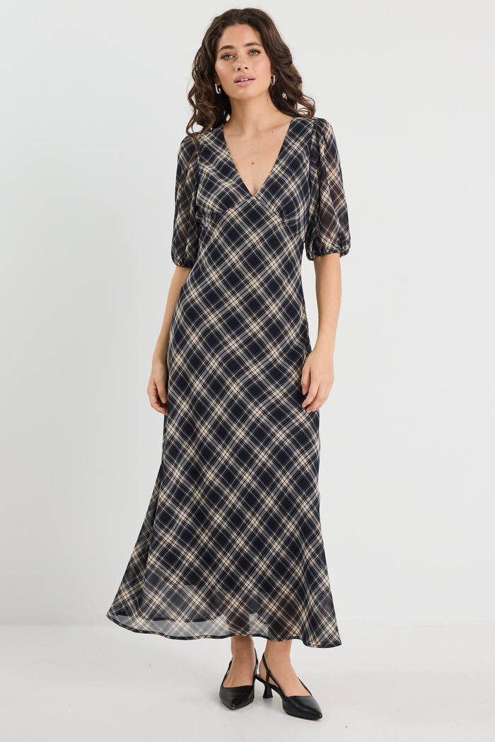 Woman wearing a check midi dress