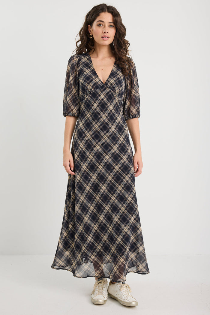 Woman wearing a check midi dress