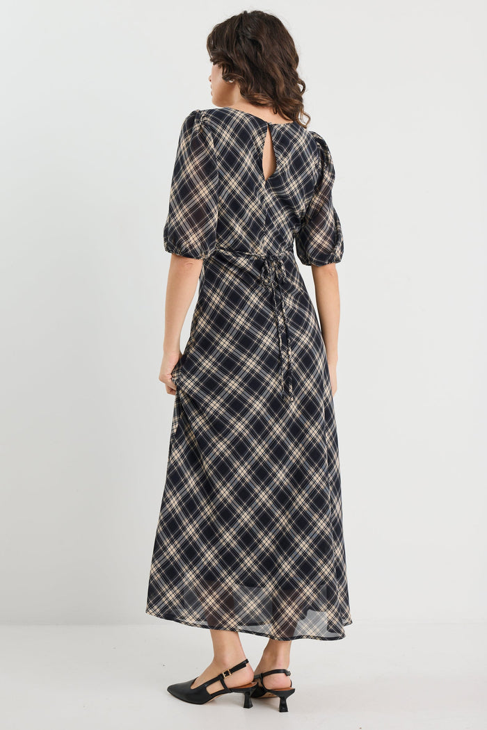 Woman wearing a check midi dress