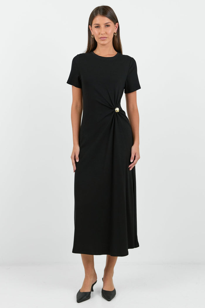 Woman wearing a black dress with a white background