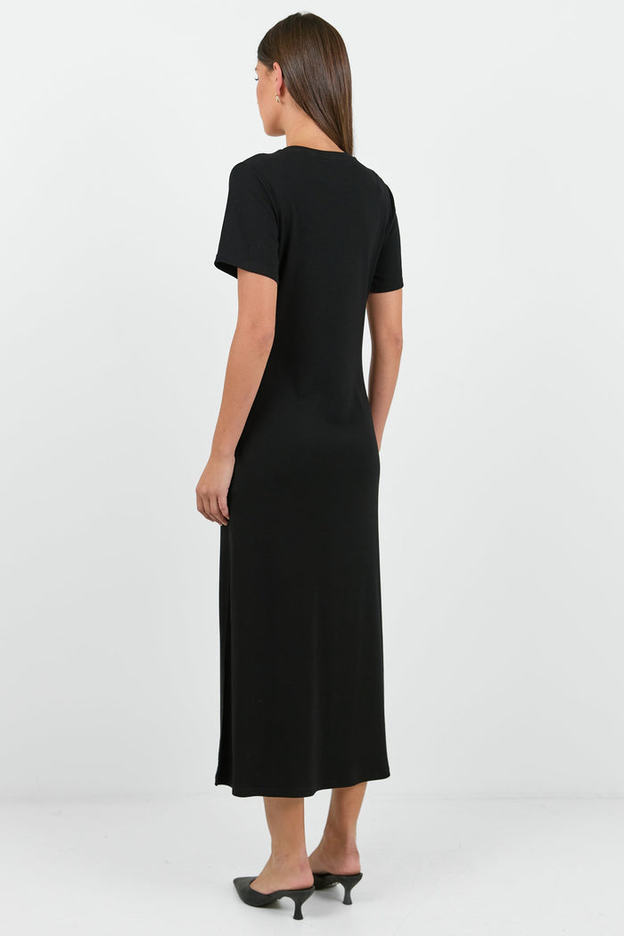 Woman wearing a black dress on a white background