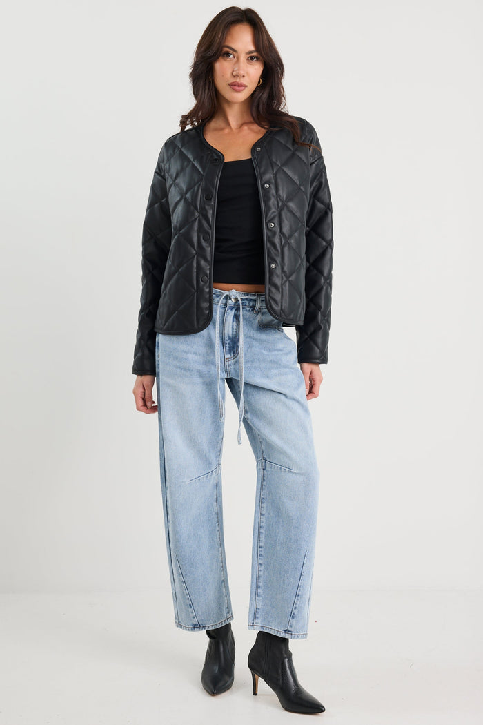 Woman wearing a black quilted jacket