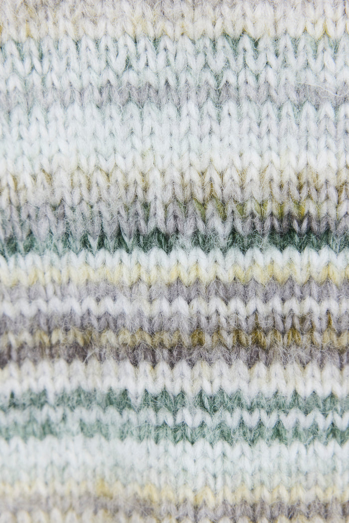 Close-up of striped fabric with green, gray, and white colors.