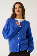 Woman wearing a blue cardigan on a white background