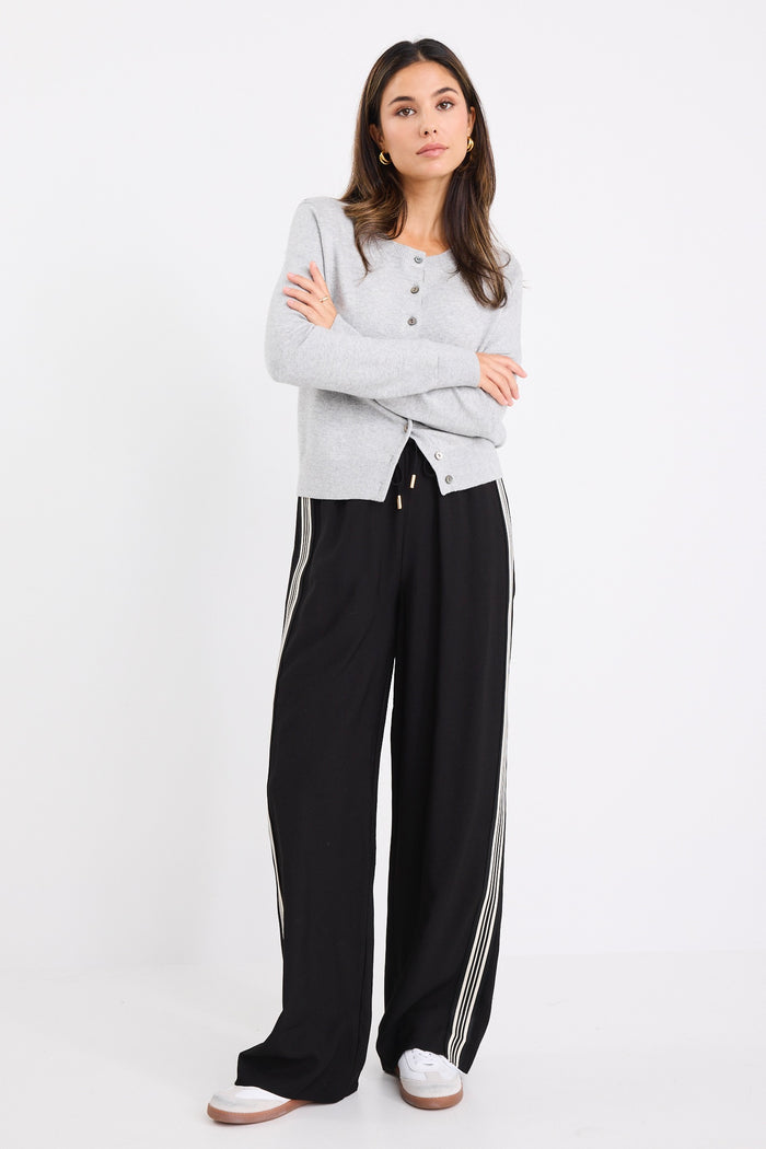 model wears a grey long sleeve cardigan