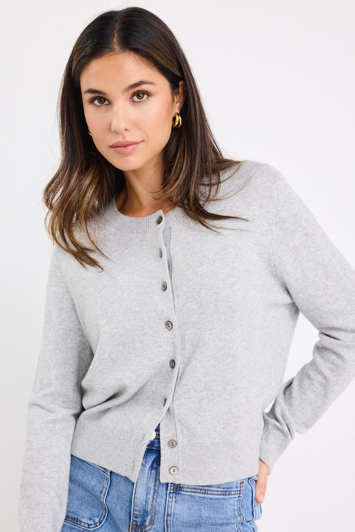 model wears a grey long sleeve cardigan