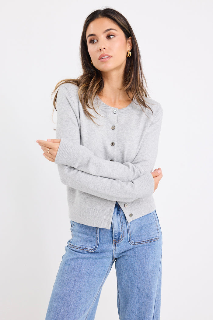 model wears a grey long sleeve cardigan