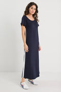 Woman wearing a navy dress with white stripes on a white background