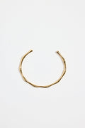 bamboo-inspired gold-plated cuff bangle with textured design, photographed flat against a white background.