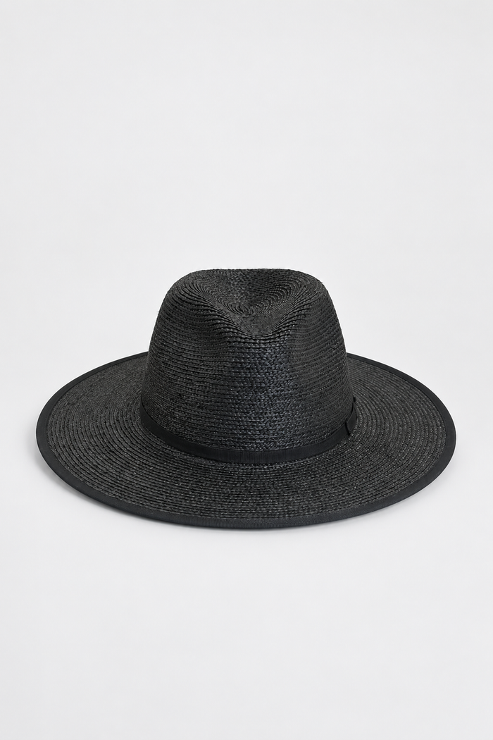 A black woven straw fedora hat with a wide brim and a matching black band, photographed against a clean white background.