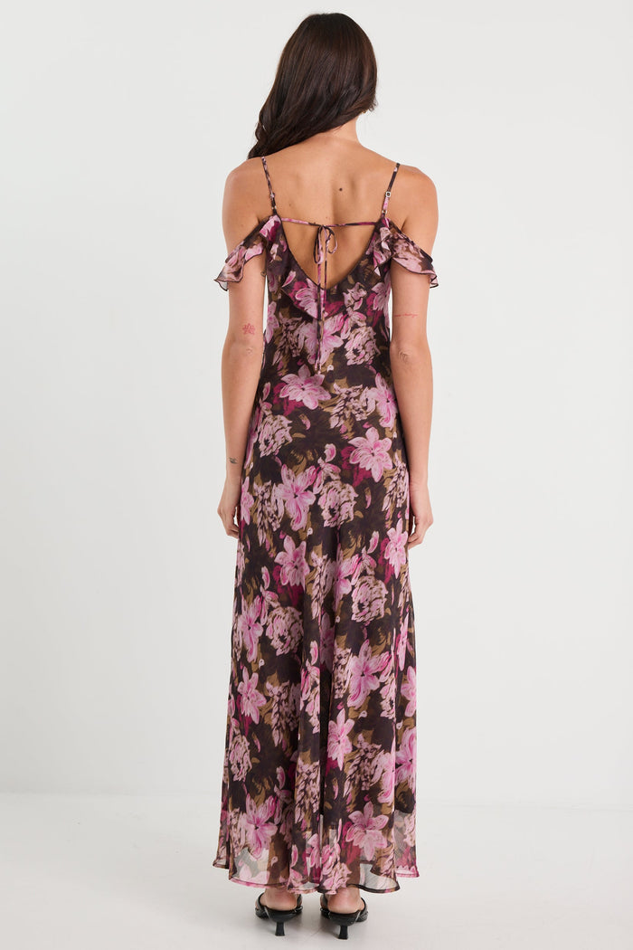 Woman wearing a floral dress on a white background