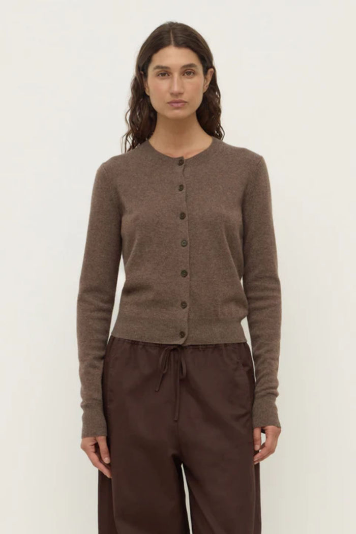Woman wearing a brown wool cardigan