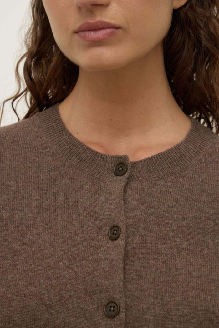 Woman wearing a brown wool cardigan