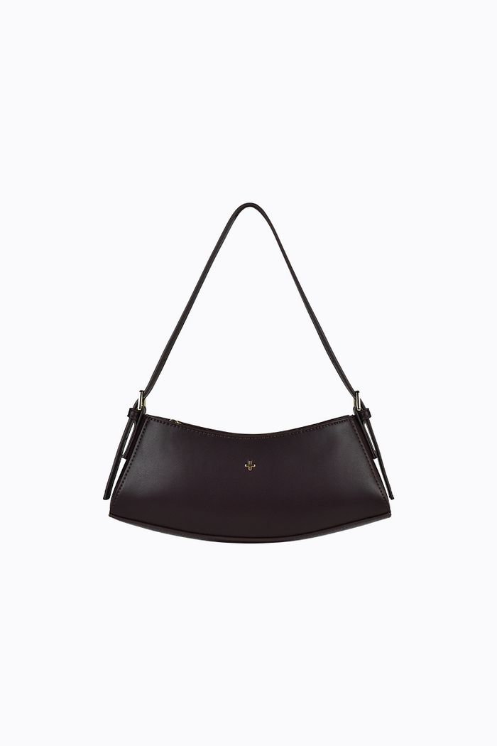 Black handbag with a strap on a white background