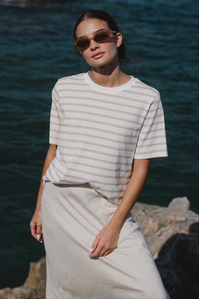 model wearing white striped tee