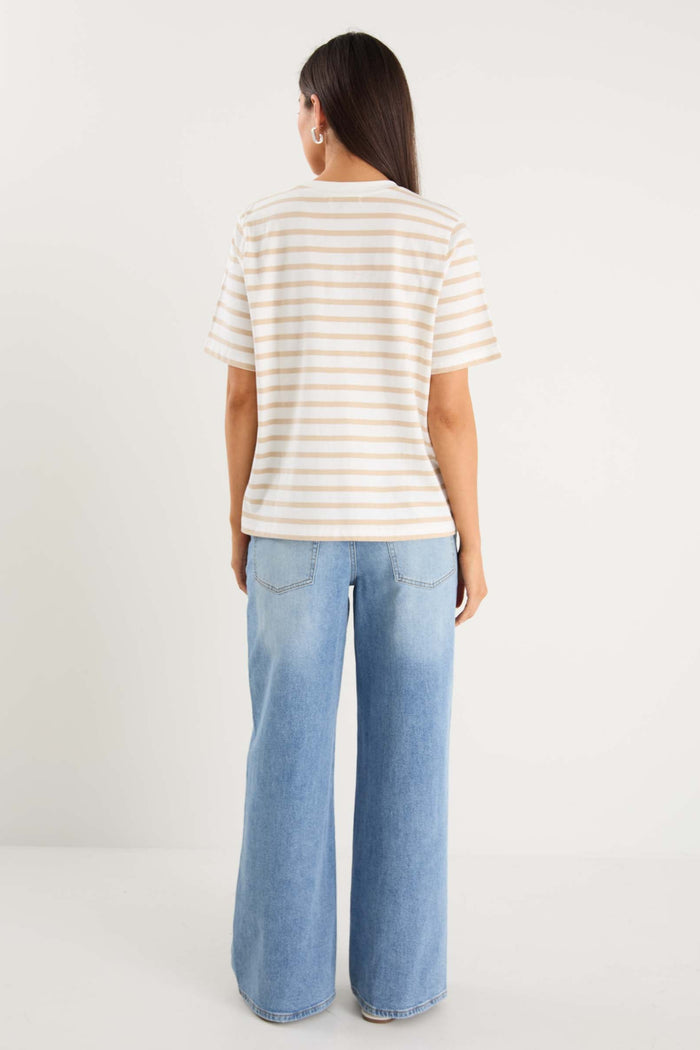 model wearing white striped tee