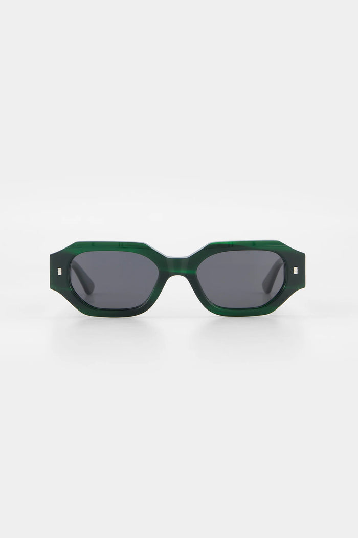 Green sunglasses with dark lenses on a white background
