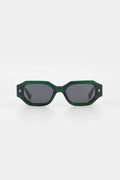 Green sunglasses with dark lenses on a white background