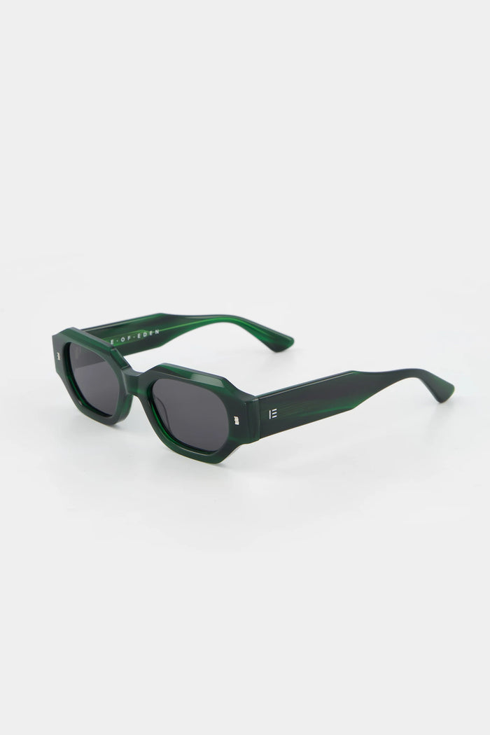 Green sunglasses on a white background