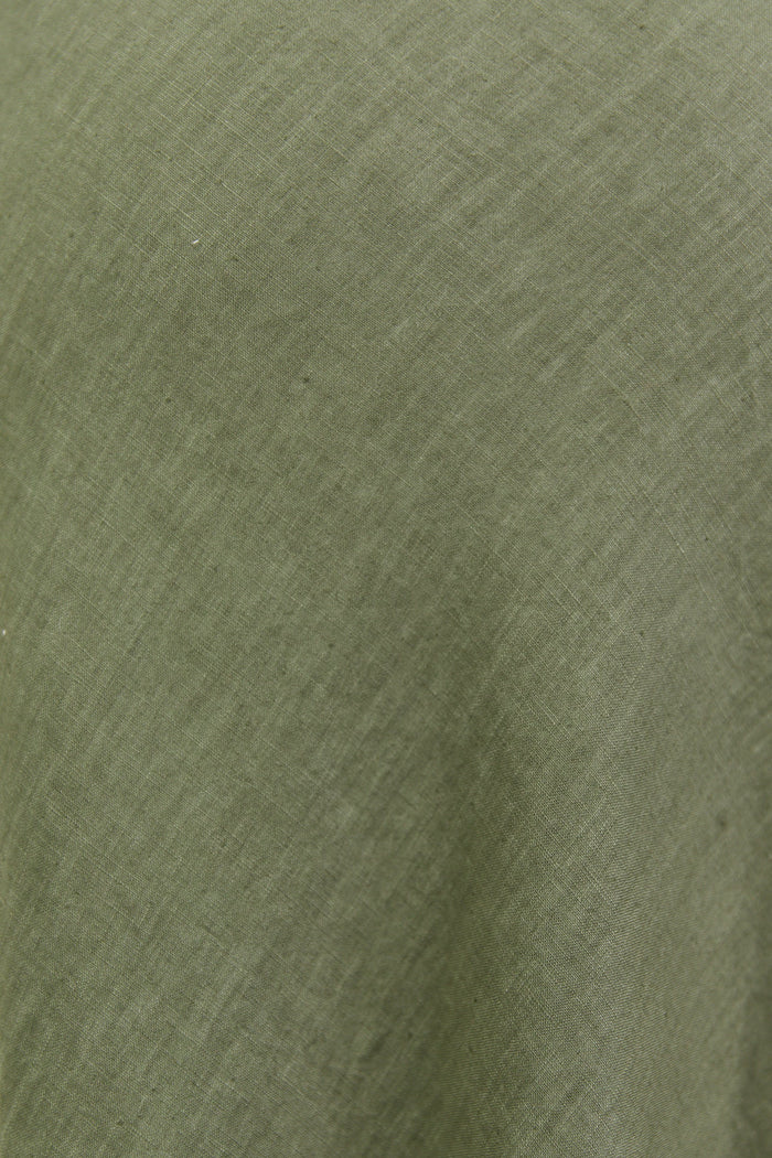 Close-up of a textured green fabric surface