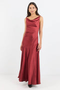 Woman wearing a burgundy evening gown on a white background