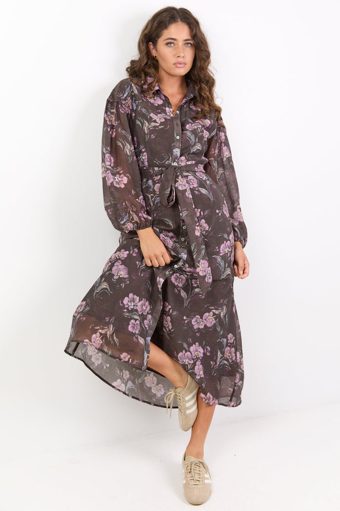 Woman wearing a floral dress on a white background