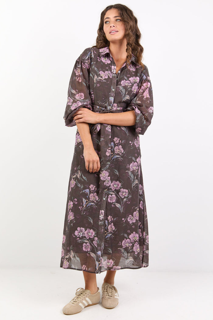 Woman wearing a floral dress on a white background