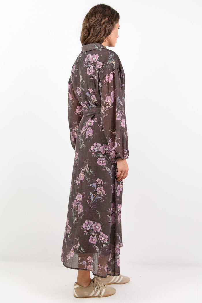 Person wearing a floral dress on a white background