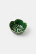 A small green ceramic bowl with a lotus petal shape and a leaf vein pattern printed inside, shown on a light gray background.