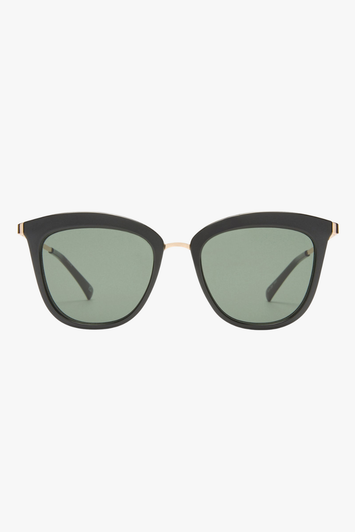 cat-eye sunglasses featuring a sleek black frame paired with khaki-tinted lenses. A slim gold-tone bridge and matching gold arm accents elevate the look with a modern, minimalist touch.