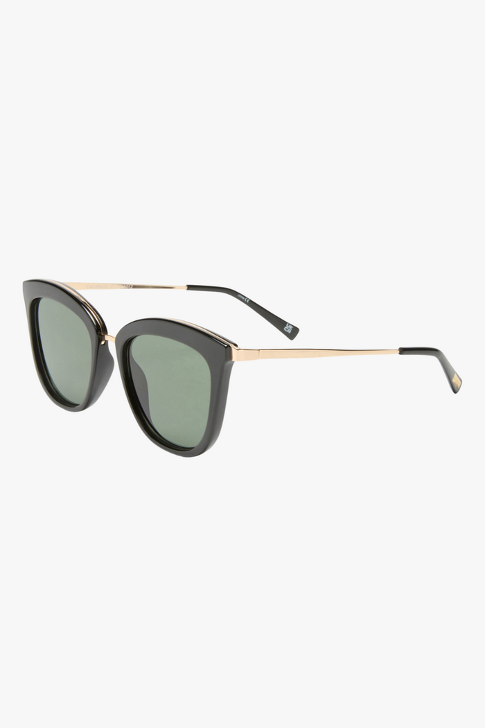 cat-eye sunglasses featuring a sleek black frame paired with khaki-tinted lenses. A slim gold-tone bridge and matching gold arm accents elevate the look with a modern, minimalist touch.
