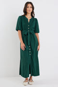 Woman wearing a green dress on a white background