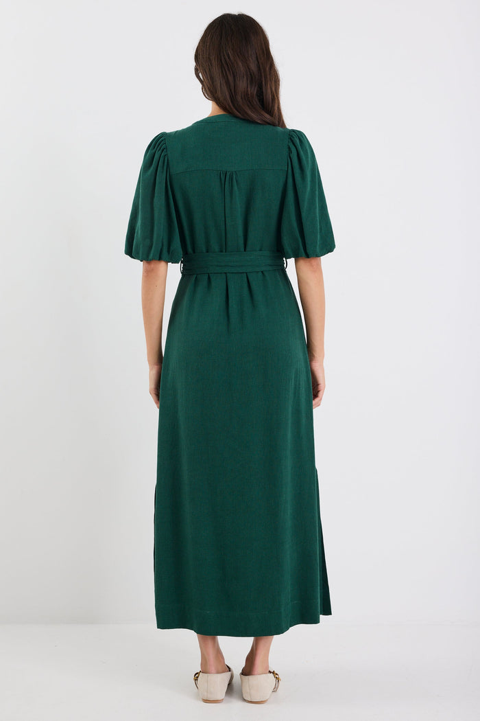 Woman wearing a green dress on a white background