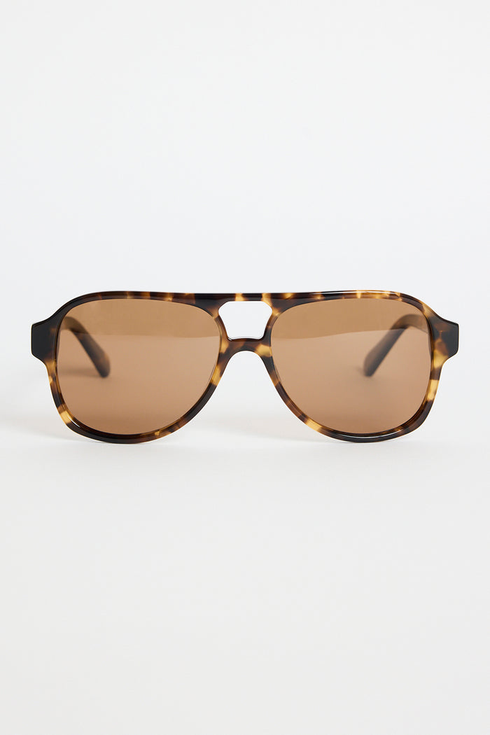 Tortoiseshell aviator sunglasses with warm brown tinted lenses, photographed on a white background.