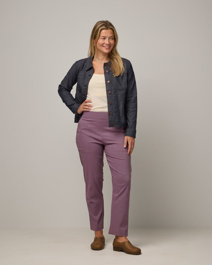 Model wearing Canyon Straight Leg Pant in Lavender. Canyon Straight Leg Pant is a merino wool pant with pockets available in sizes XS-3X Regular and XS-XXL Long.