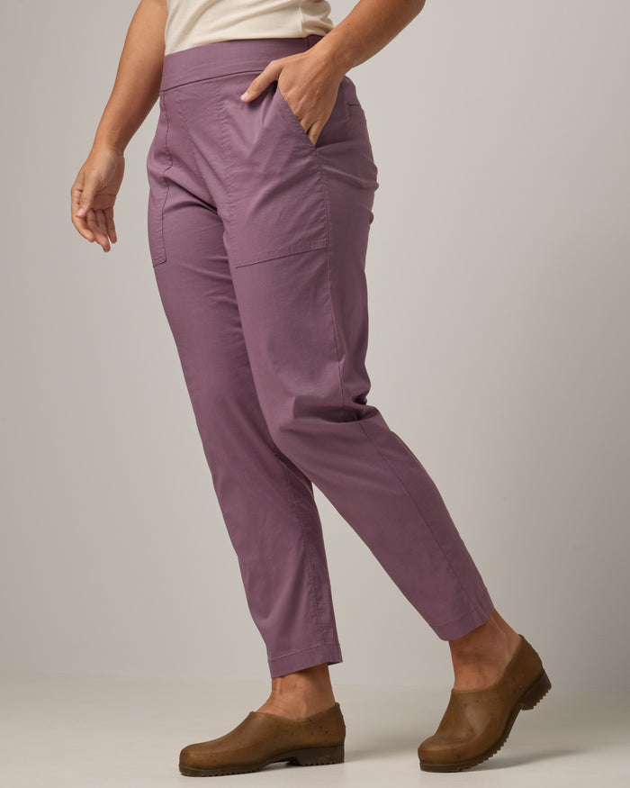 Model wearing Canyon Straight Leg Pant in Lavender. Canyon Straight Leg Pant is a merino wool pant with pockets available in sizes XS-3X Regular and XS-XXL Long.
