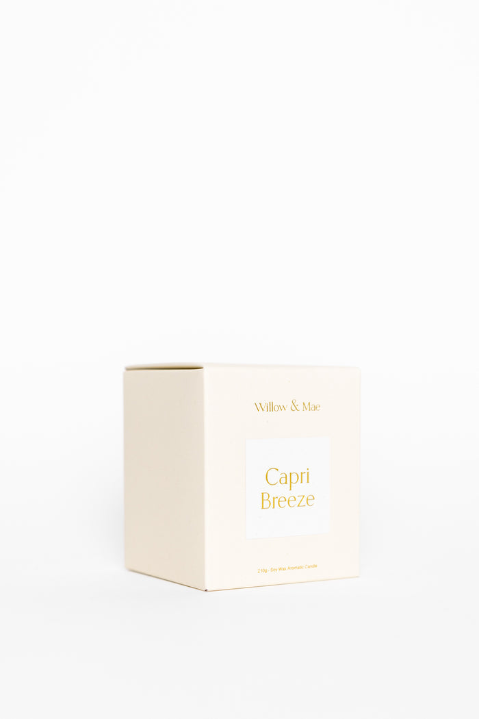 White candle box with 'Capri Breeze' text on a white background