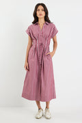 Woman wearing a striped dress on a white background