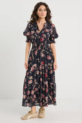 Woman wearing a floral dress on a white background