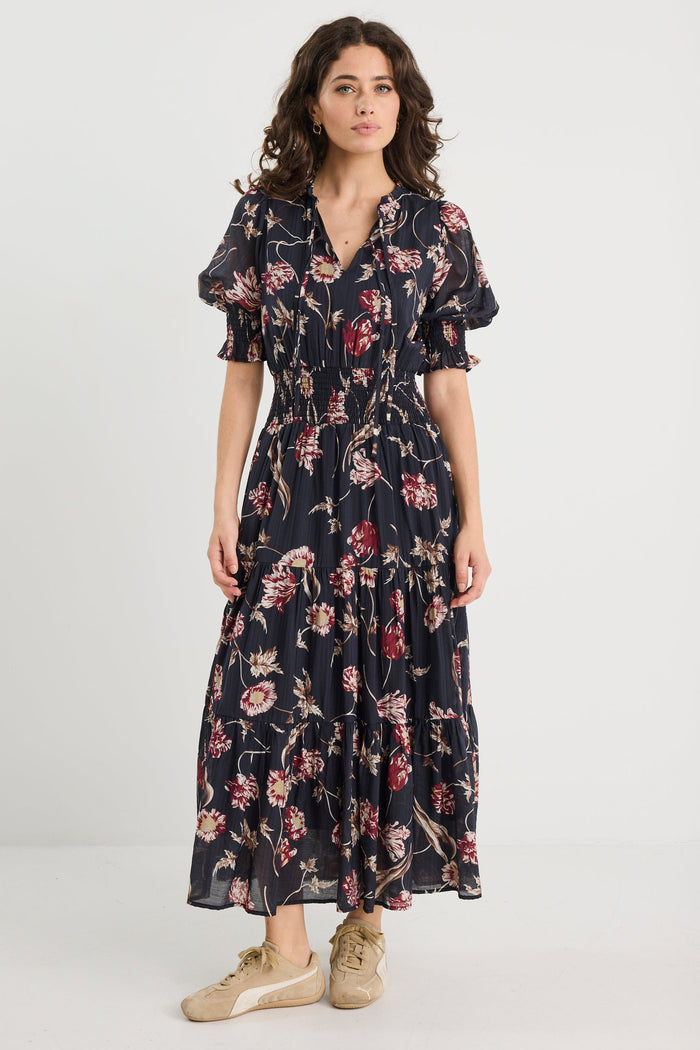 Woman wearing a floral dress on a white background