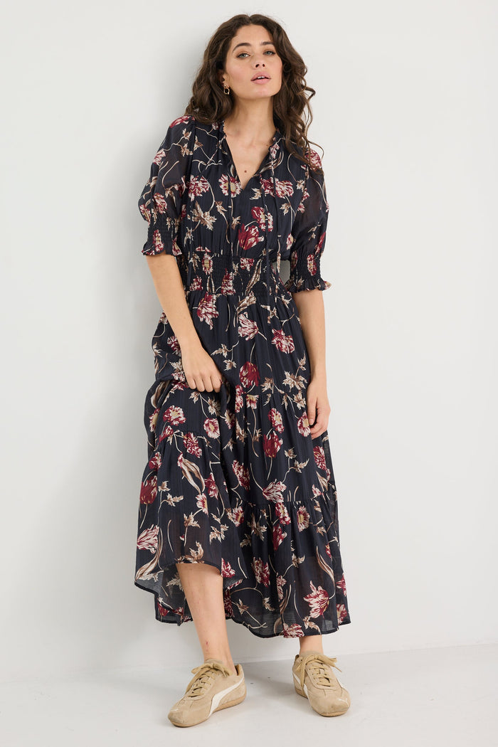 Woman wearing a floral dress on a white background
